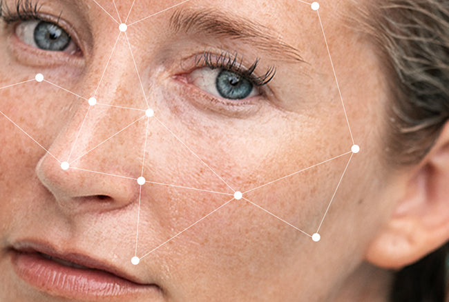 Close-up of a woman's face with geometric lines overlaying it