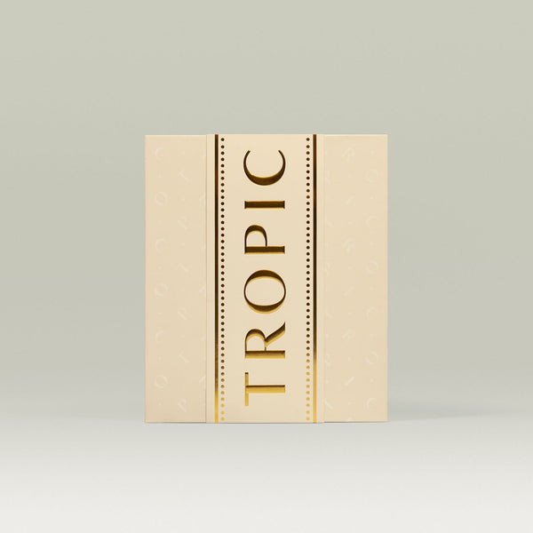 Tropic 12 Days of Tropic Advent Calendar – cream-coloured box with gold embossed 'TROPIC' lettering and subtle background pattern.