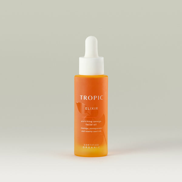 Tropic Elixir enriching omega facial oil. Moringa, pomegranate and rosehip seed oils.
Certified Organic.
Glass bottle that is orange due to the product colour. A embossed leaf features behind white text. White pipette dispenser.