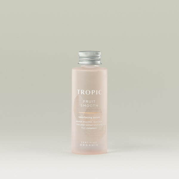 Tropic Fruit Smooth resurfacing serum Refill. Papaya enzymes, Australian Lime pearl extract and AHA fruit complexes. Certified Organic. 
White pipette dispenser, light pink glass bottle with white writing and embossed design behind the text.