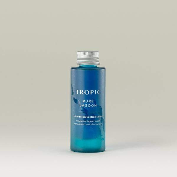 Tropic Pure Lagoon blemish prevention serum refill. Contains Polynesian lagoon water, bioflavonoids and blue spirulina. 
Bright blue glass bottle with aluminium screw top. There is a wavy embossed design behind the white text.