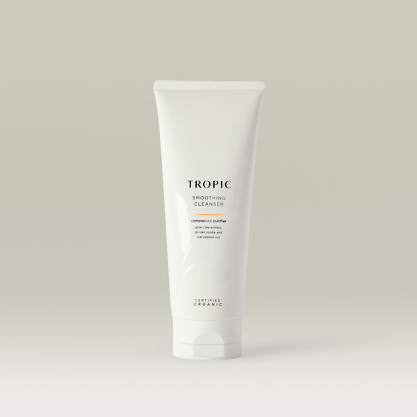 Tropic Smoothing Cleanser complexion purifier 240ml
Contains green tea extract, golden jojoba and macadamia oils. Certified Organic. White squeeze tube with white lid. Leaf design features behind black text.