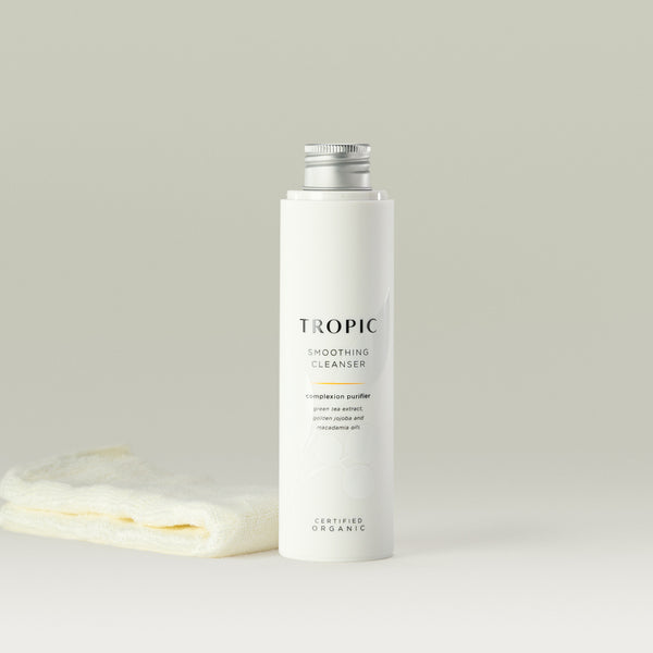 Tropic Smoothing Cleanser complexion purifier 120ml refill with bamboo face cloth.
Contains green tea extract, golden jojoba and macadamia oils. Certified Organic. White tube with white lid. Leaf design features behind black text.