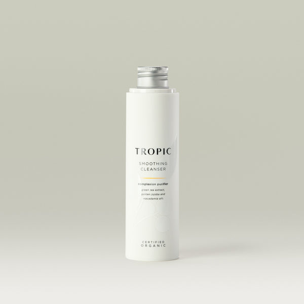 Tropic Smoothing Cleanser complexion purifier 120ml Refill.
Contains green tea extract, golden jojoba and macadamia oils. Certified Organic. White tube with white lid. Leaf design features behind black text.