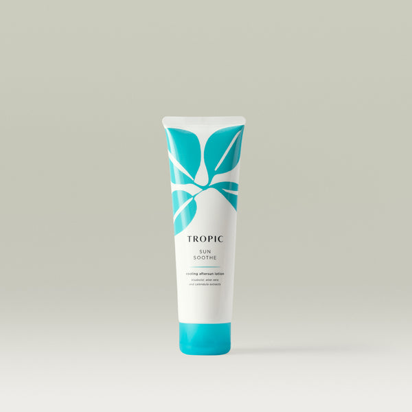 Mini Tropic Sun Soothe cooling aftersun lotion. White bottle with turquoise leaf design, black text and turquoise lid.