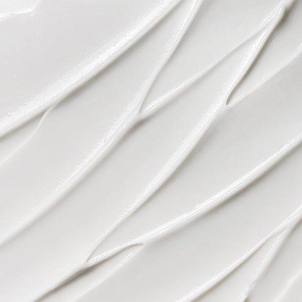 Close-up texture of Tropic Feel Fresh Soothing Deodorant and Antiperspirant Cream with smooth, creamy white consistency.