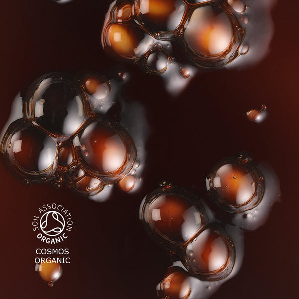 Close up of sun drops texture, the liquid has a rich, deep color. The image also features the 