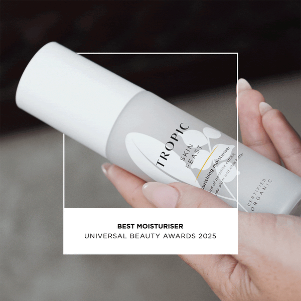 A person holding a white bottle of Tropic Skin Feast Nourishing Moisturiser. The text overlay says, “Best Moisturiser – Universal Beauty Awards 2025. A verified buyer quotes: 