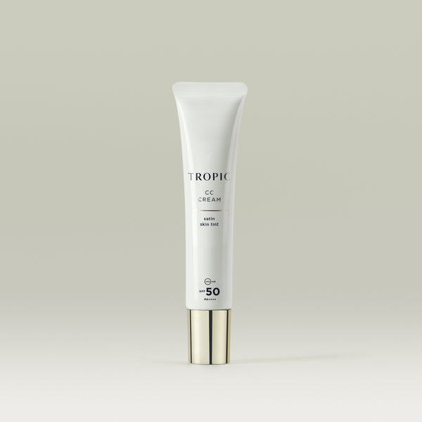 Image shows CC Cream satin skin tint. A white tube with a gold cap lid. It contains SPF 50.