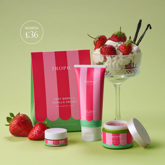 Tropic’s limited-edition Very Berry & Vanilla Velvet gift set displayed against a soft green background. The collection includes a body lotion, body scrub and lip fudge, styled with fresh strawberries and a strawberry-and-cream dessert topped with vanilla pods. A circular graphic in the top left reads “Worth £36.”