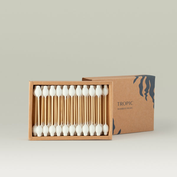 Open box of Tropic Bamboo Buds containing 31 bamboo cotton swabs, with the lid partially visible in the background.