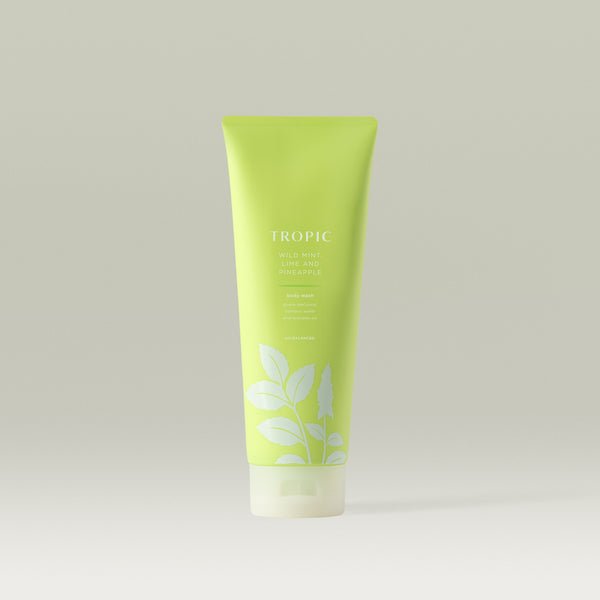 Tropic Wild Mint, Lime and Pineapple Body Wash in a fresh green tube with botanical design.