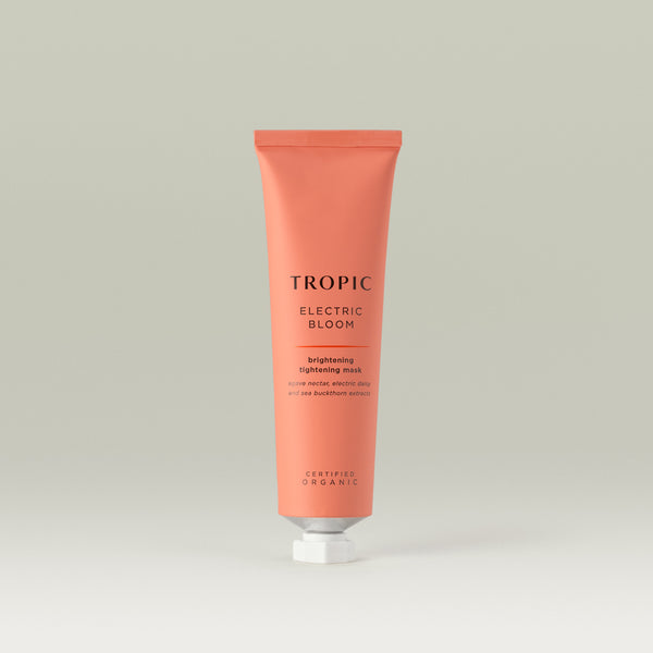 Tropic Electric Bloom brightening tightening mask. Agave nectar, electric daisy and sea buckthorn extracts. Pink aluminium tube with white screw cap.