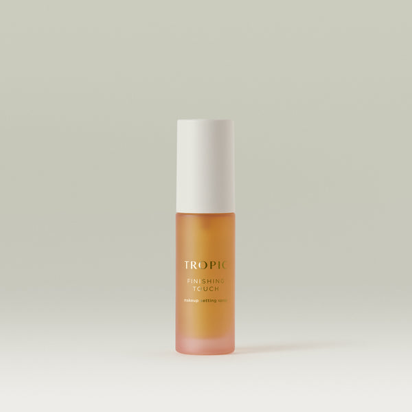 A single Tropic Finishing Touch mini setting spray on a clean, neutral background.