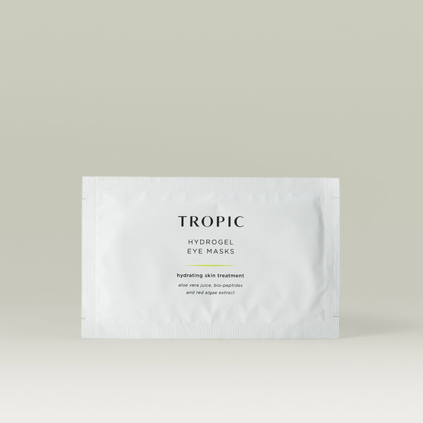 Tropic Hydrogel eye masks hydrating skin treatment. Aloe Vera Juice, bio peptides and red algae extract. White sachet with black text.