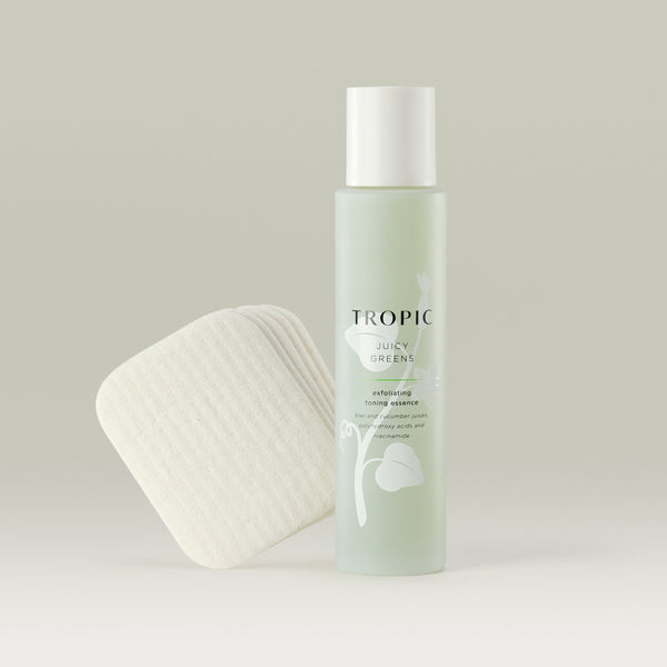 Tropic Juicy Greens exfoliating toning essence with Forest Leaves reusable facial pads.
Juicy Greens contains: Kiwi and cucumber juices, polyhydroxy acids and niacinamide. 
Light green glass bottle with white plastic top and leaf design behind black text. 