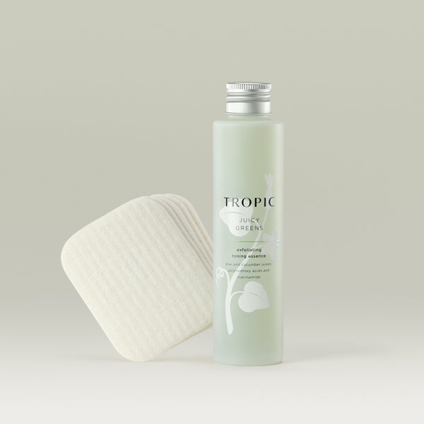 Tropic Juicy Greens exfoliating toning essence refill with Forest Leaves reusable facial pads.
Juicy Greens contains: Kiwi and cucumber juices, polyhydroxy acids and niacinamide. 
Light green glass bottle with aluminium screw top and leaf design behind black text. 