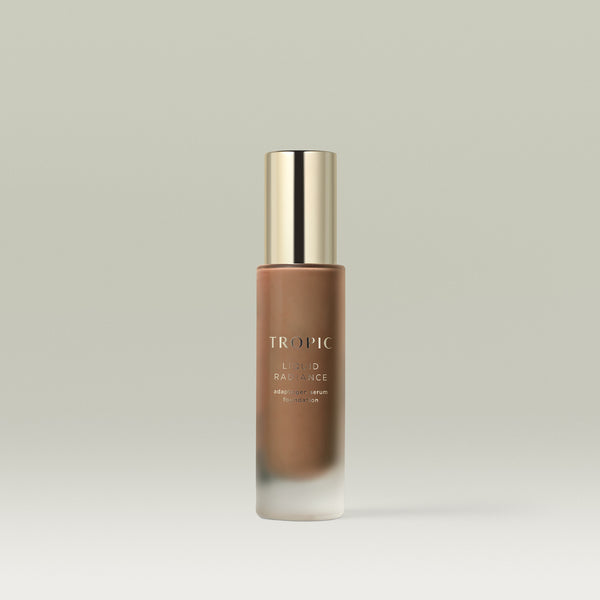 A pump bottle of Tropic Liquid Radiance adaptogen serum foundation in shade 10.