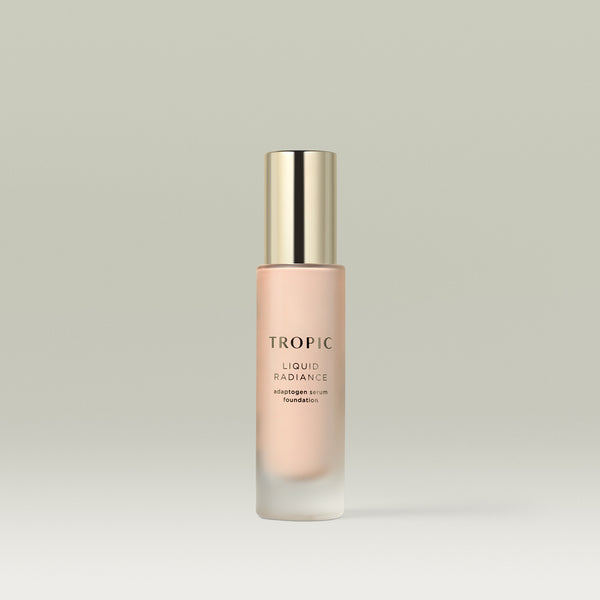 A pump bottle of Tropic Liquid Radiance adaptogen serum foundation in shade 1