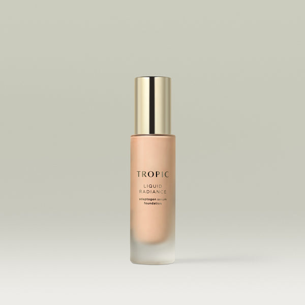 A pump bottle of Tropic Liquid Radiance adaptogen serum foundation in shade 3