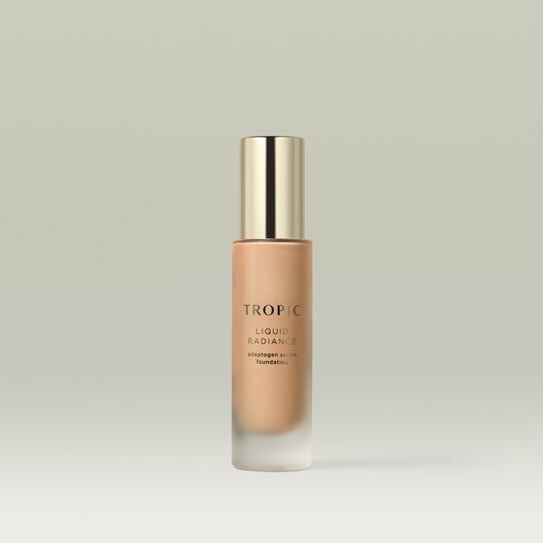 A pump bottle of Tropic Liquid Radiance adaptogen serum foundation in shade 6