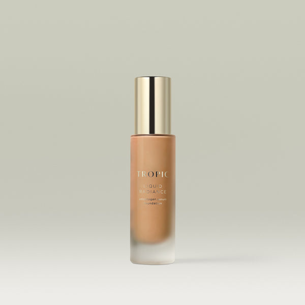 A pump bottle of Tropic Liquid Radiance adaptogen serum foundation in shade 7