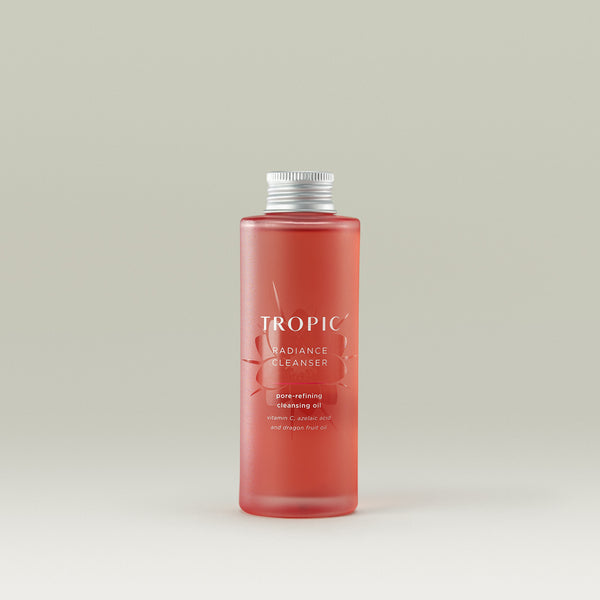 Tropic Radiance Cleanser pore-refining cleansing oil refill. Contains Vitamin C, azelaic acid and dragon fruit oil.

Aluminium screw cap. Pink glass bottle with floral embossed design behind white text.