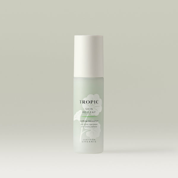 Tropic Skin Re-Leaf soothing moisturiser bottle with white cap, formulated with leaf of life, tiger grass, and tamanu extracts, certified organic, displayed on a neutral background.