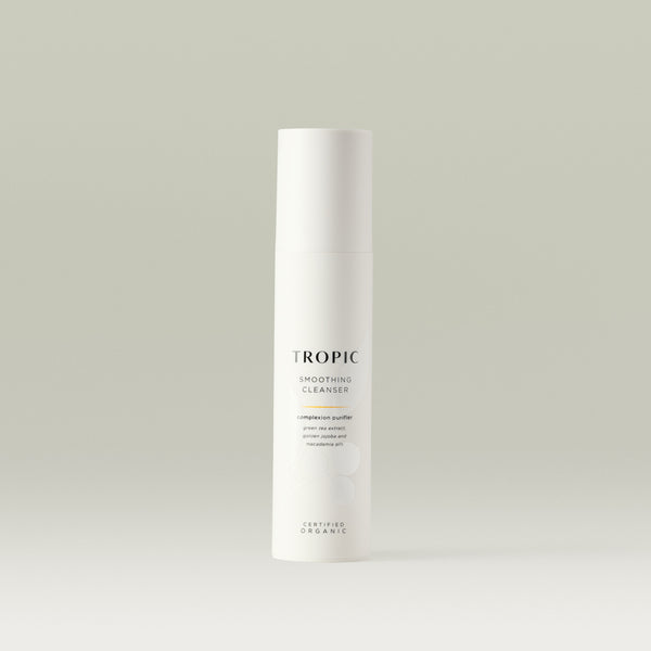Tropic Smoothing Cleanser complexion purifier 120ml.
Contains green tea extract, golden jojoba and macadamia oils. Certified Organic. White tube with white lid. Leaf design features behind black text. 