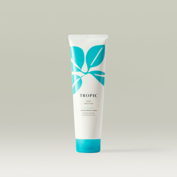 Tropic Sun Soothe cooling aftersun lotion. White bottle with turquoise leaf design, black text and turquoise lid.