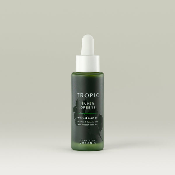 Tropic Super Greens nutrient boost oil. 
Contains Vitamin C, tamanu, kale and broccoli seed oils.  Certified Organic.
White pipette dispenser on dark green glass bottle with embossed leaf design behind white text.