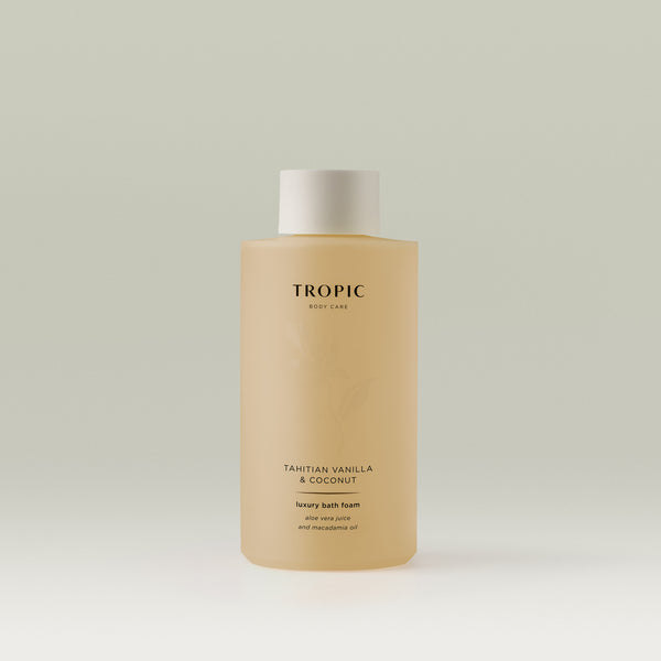 Tropic Body Care Tahitian Vanilla & Coconut Luxury Bath Foam bottle with aloe vera juice and macadamia oil, displayed on a neutral background.