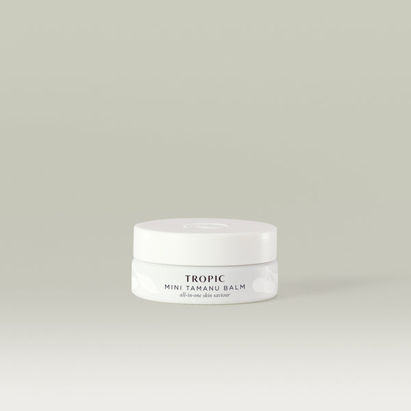Tropic Mini Tamanu Balm: a small, all-in-one skin saviour in a minimal white jar designed to soothe, repair, and nourish skin.