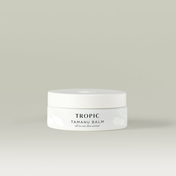 Tropic Tamanu Balm all-in-one skin saviour in a white jar on a neutral background.
