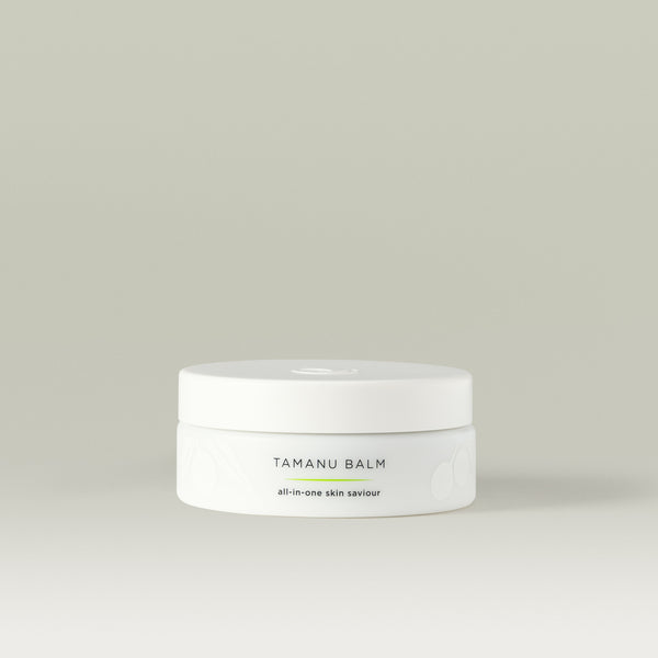 Tamanu Balm all-in-one skin saviour. 
White round tub with Tropic logo on the lid and faint white leaf design on the bottom of the tub.